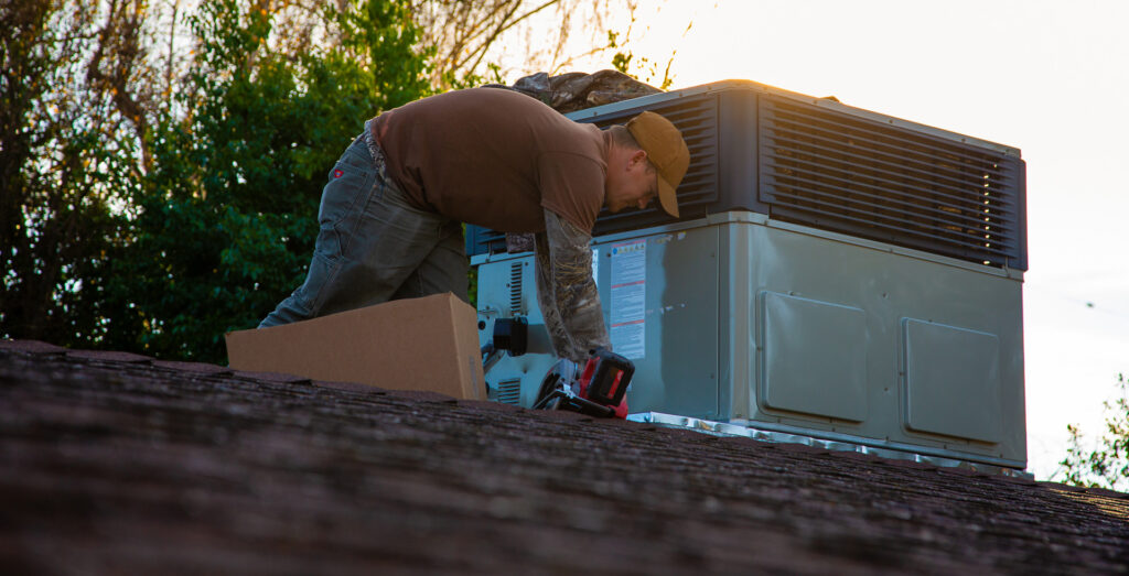 A man repairing an old roof.