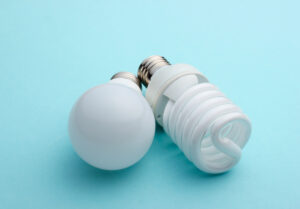 A picture of two types of lightbulbs on a blue background.