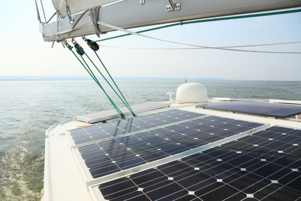 Solar panels placed on the top of a seaborne boat. 