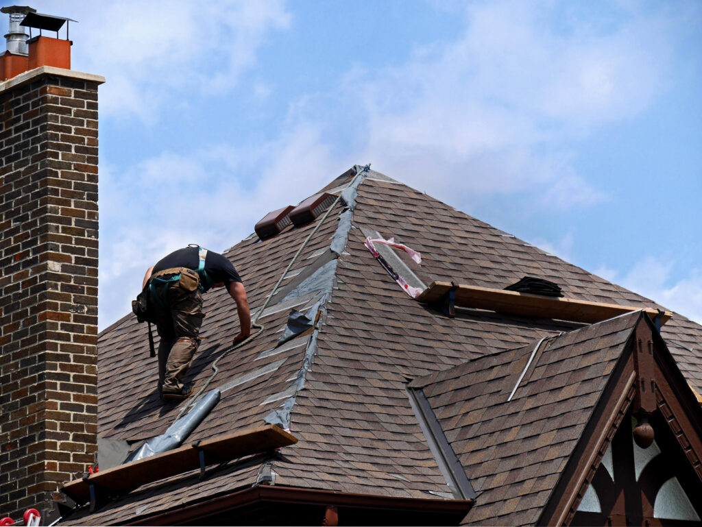 A picture of someone repairing a roof.