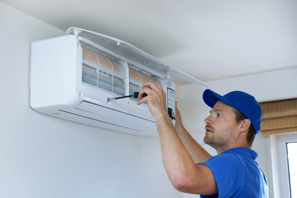 A technician working on an HVAC unit.