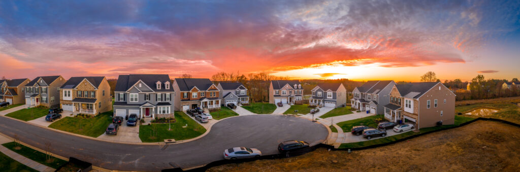 A panoramic aerial view of a California neighborhood at sunset.