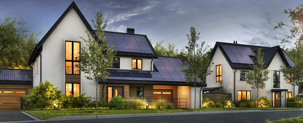 An aesthetic shot of a house with solar panels reflecting a purple sky.