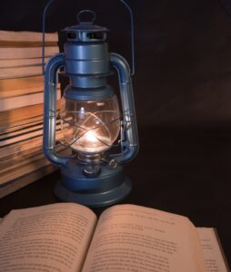 A picture of a book lit by a lamp.0