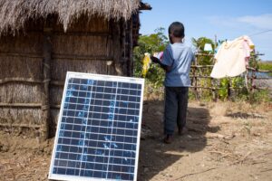 A picture of a hut powered by a single solar panel.