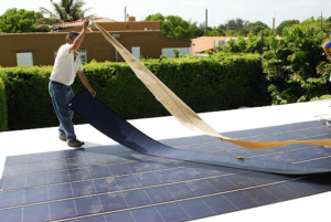 A picture of a roof with flexible solar panels.