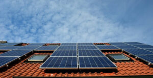 A picture of a roof with solar panels installed far apart from one another.