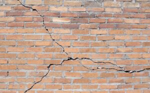 Cracks in a house's foundation.