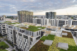 An aerial view of the green, grassy roof of an apartment complex.