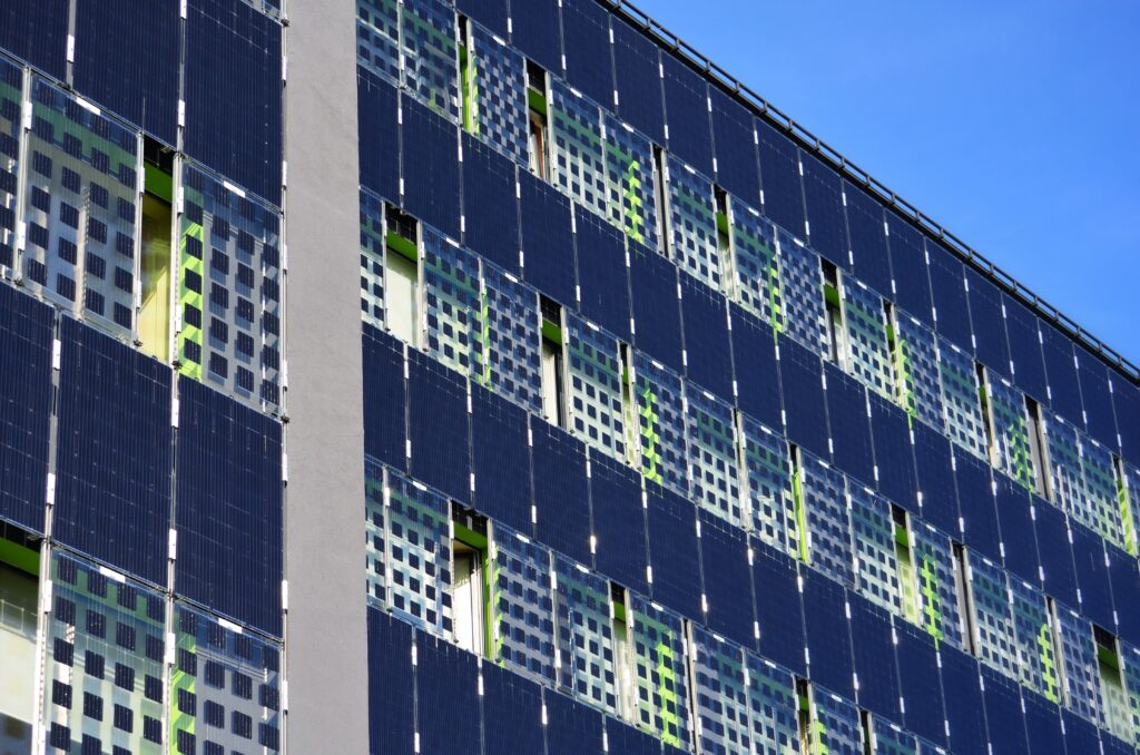 An image of solar panels which have replaced external walls of an apartment complex.