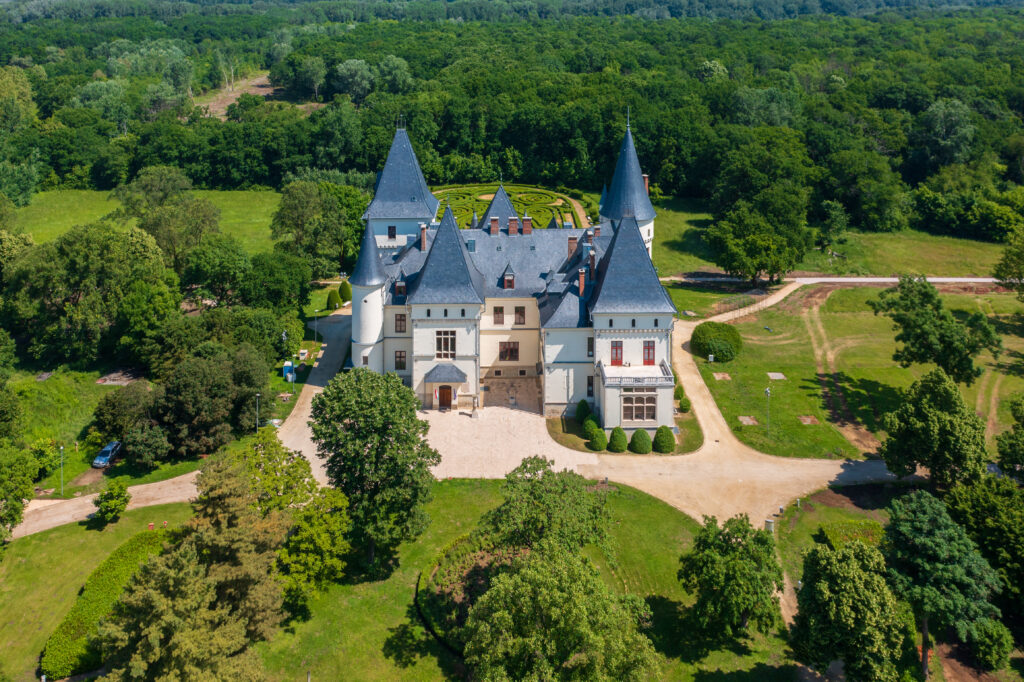 A small castle with slate roof.