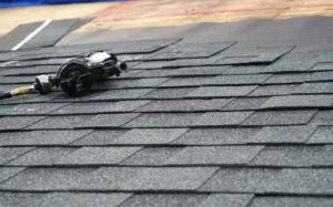 An asphalt roof in the middle of installation.