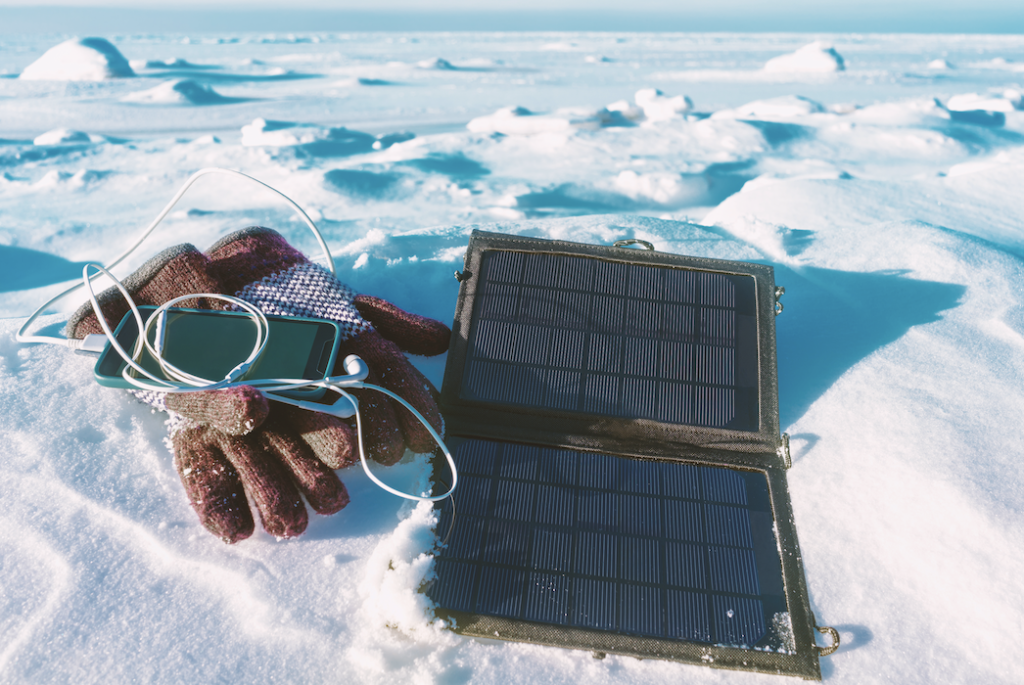 A tiny foldable solar panel on snow. 