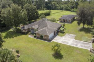 A ranch-style home with a large yard.